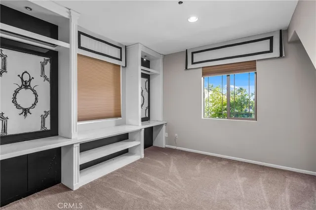 a view of room with window and hallway