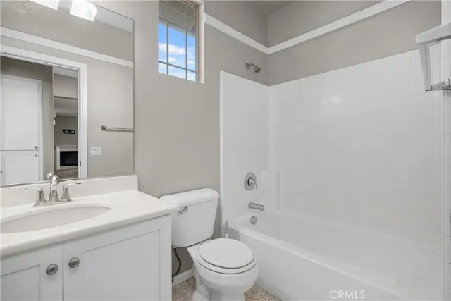 a bathroom with a sink a toilet and a bathtub