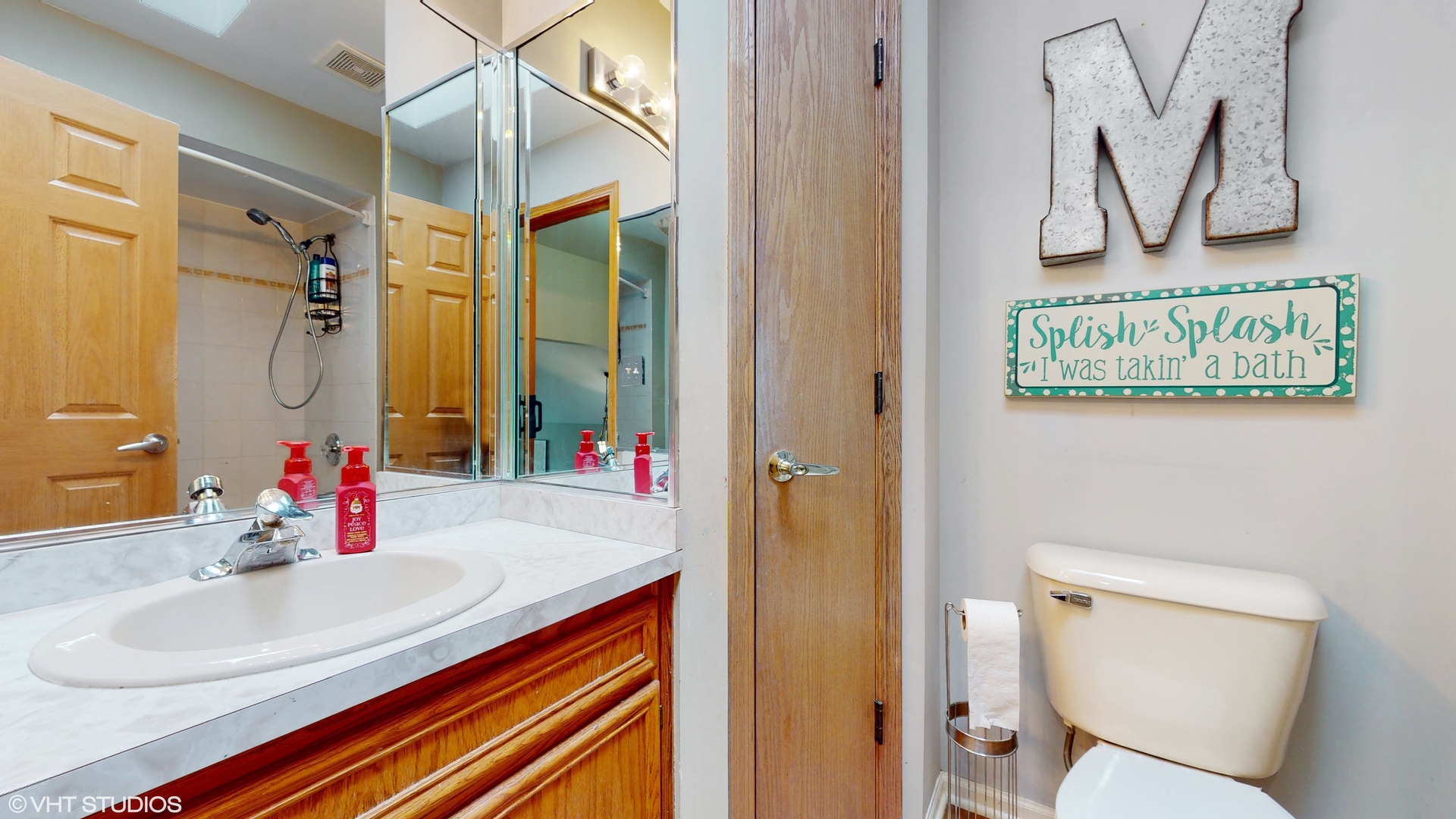 5054 Arrowhead Trace Oak Forest, IL 60452 - Photo 17 of 27 a bathroom with a sink and a mirror