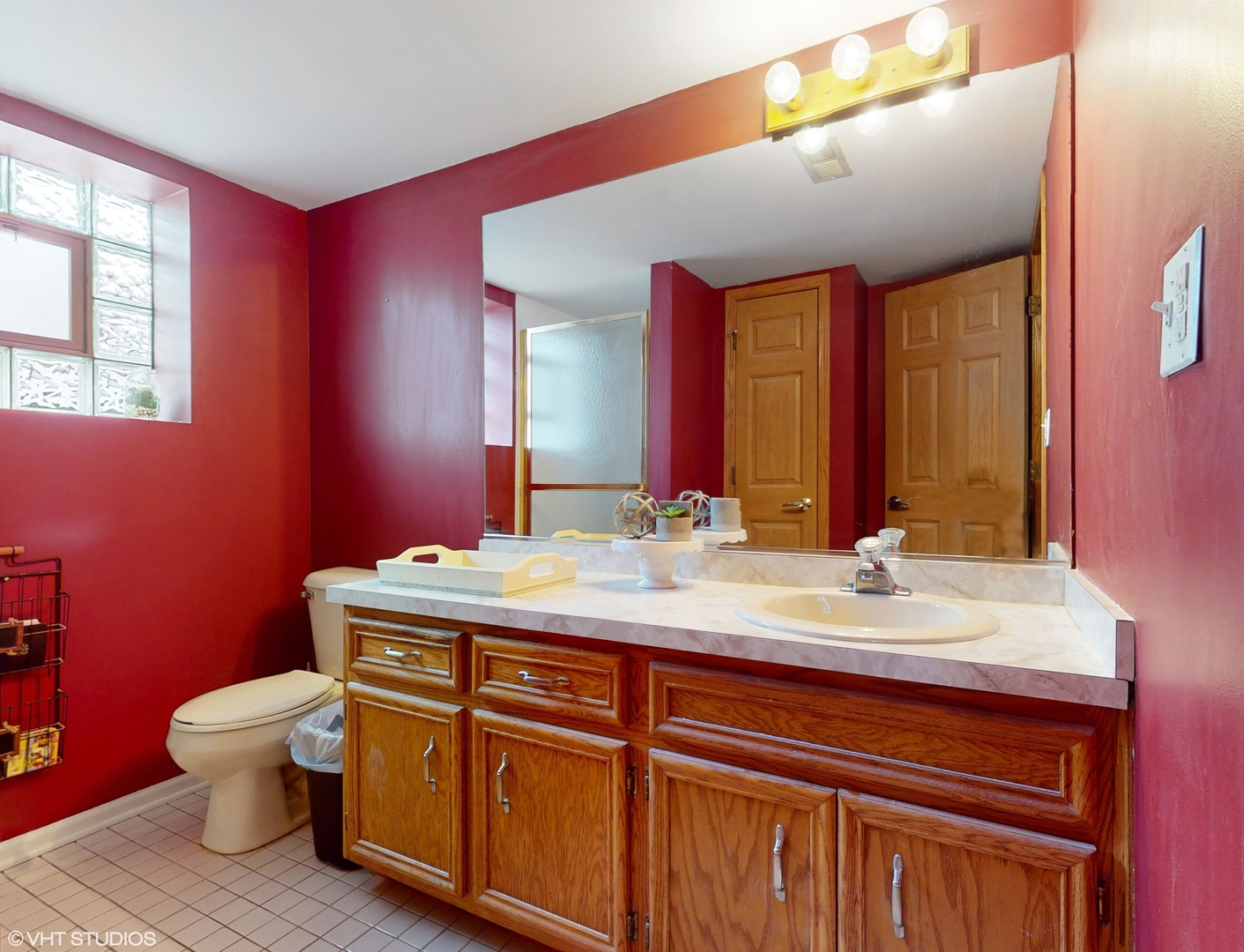 5054 Arrowhead Trace Oak Forest, IL 60452 - Photo 22 of 27 a bathroom with a granite countertop toilet sink and mirror