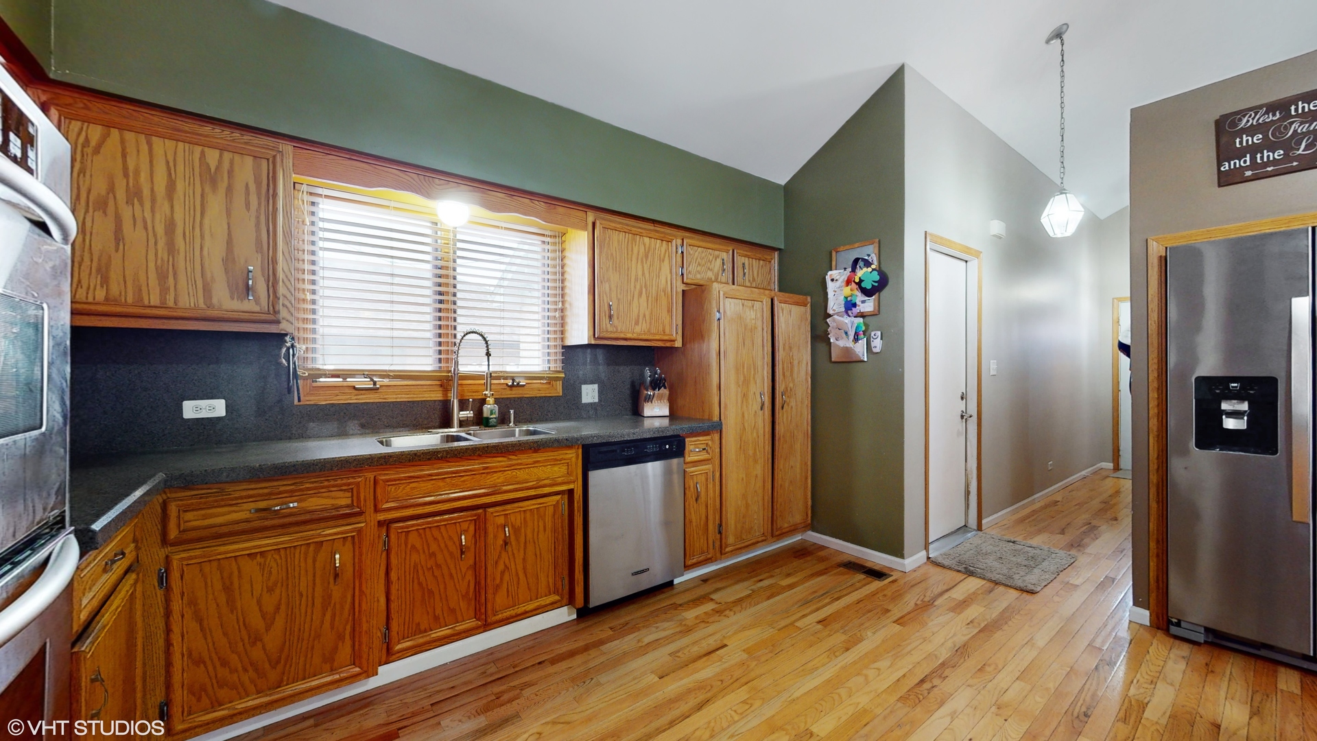 5054 Arrowhead Trace Oak Forest, IL 60452 - Photo 8 of 27 a kitchen with stainless steel appliances granite countertop a refrigerator a sink dishwasher and wooden cabinets with wooden floor