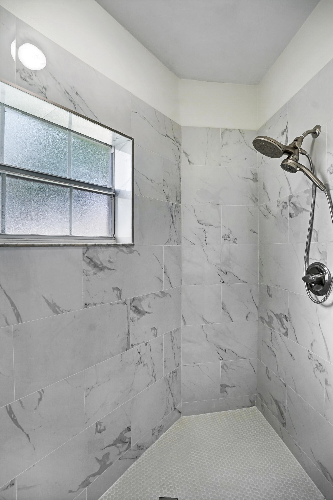 6513 Via Regina Boca Raton, FL 33433 - Photo 17 of 30 a bathroom with a shower