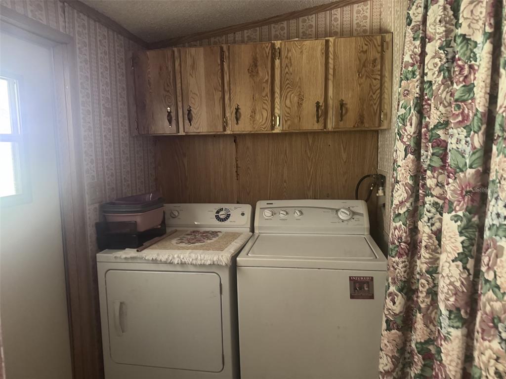 20050 Ruth Street Brooksville, FL 34601 - Photo 16 of 18 a utility room with dryer and washer