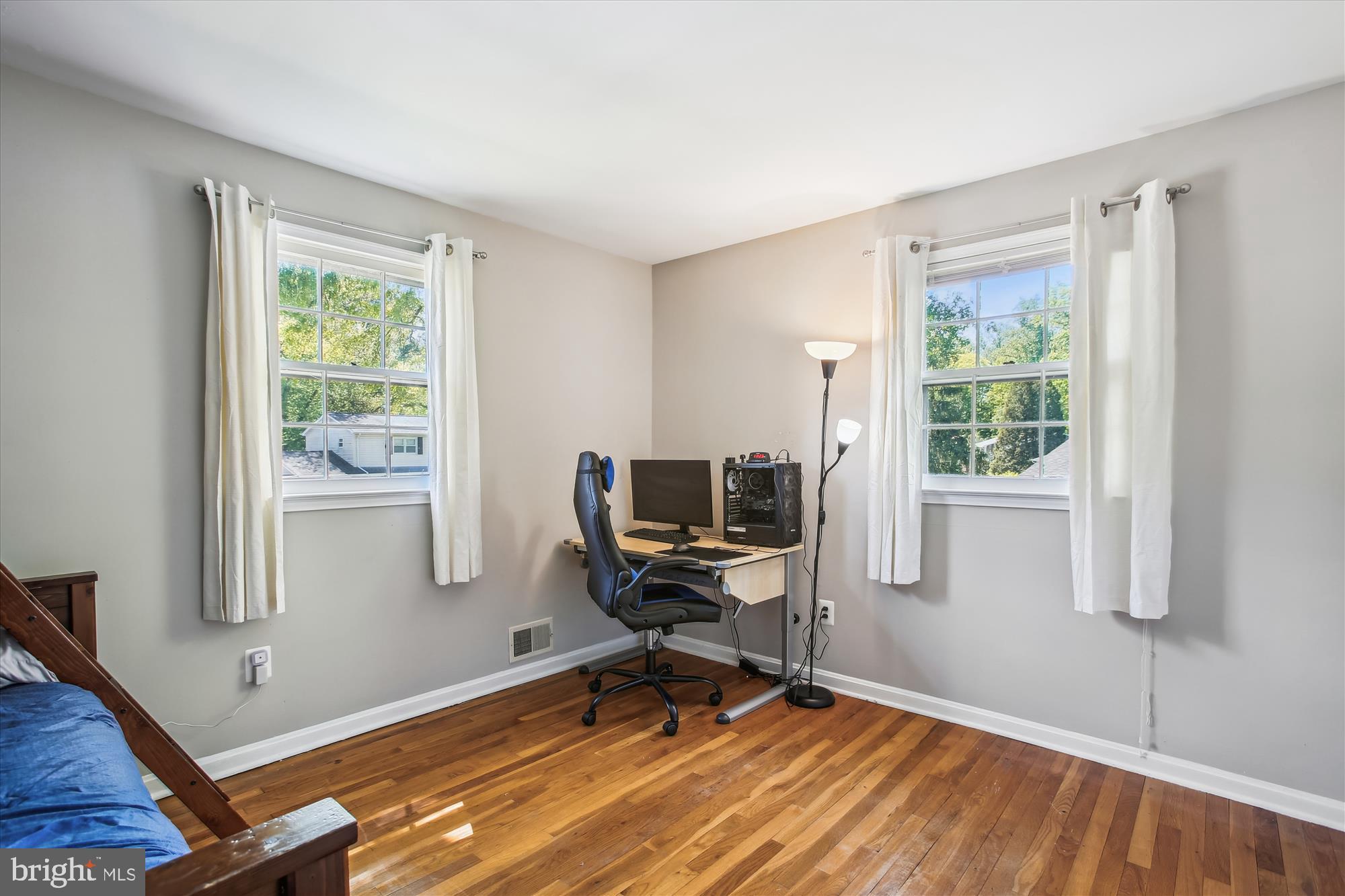 6961 Conservation Drive Springfield, VA 22153 - Photo 12 of 62 a view of a workspace with wooden floor and a window
