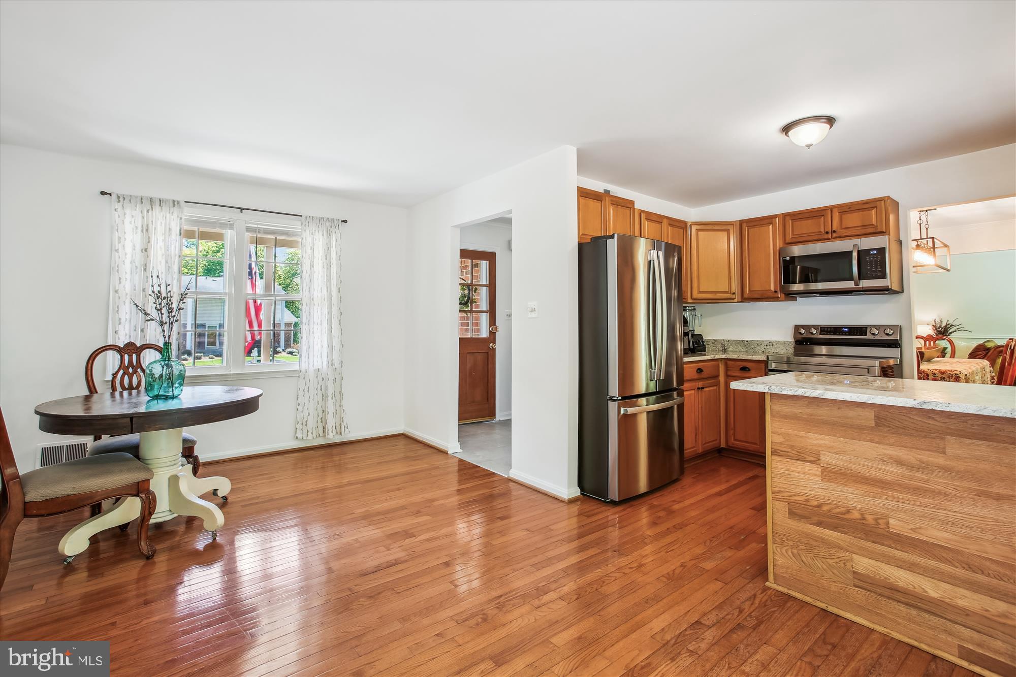 6961 Conservation Drive Springfield, VA 22153 - Photo 13 of 62 a kitchen with stainless steel appliances a refrigerator and a stove top oven