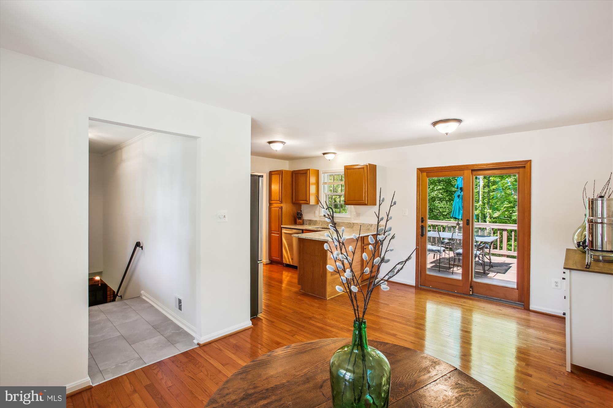 6961 Conservation Drive Springfield, VA 22153 - Photo 14 of 62 a view of a livingroom with furniture wooden floor and windows