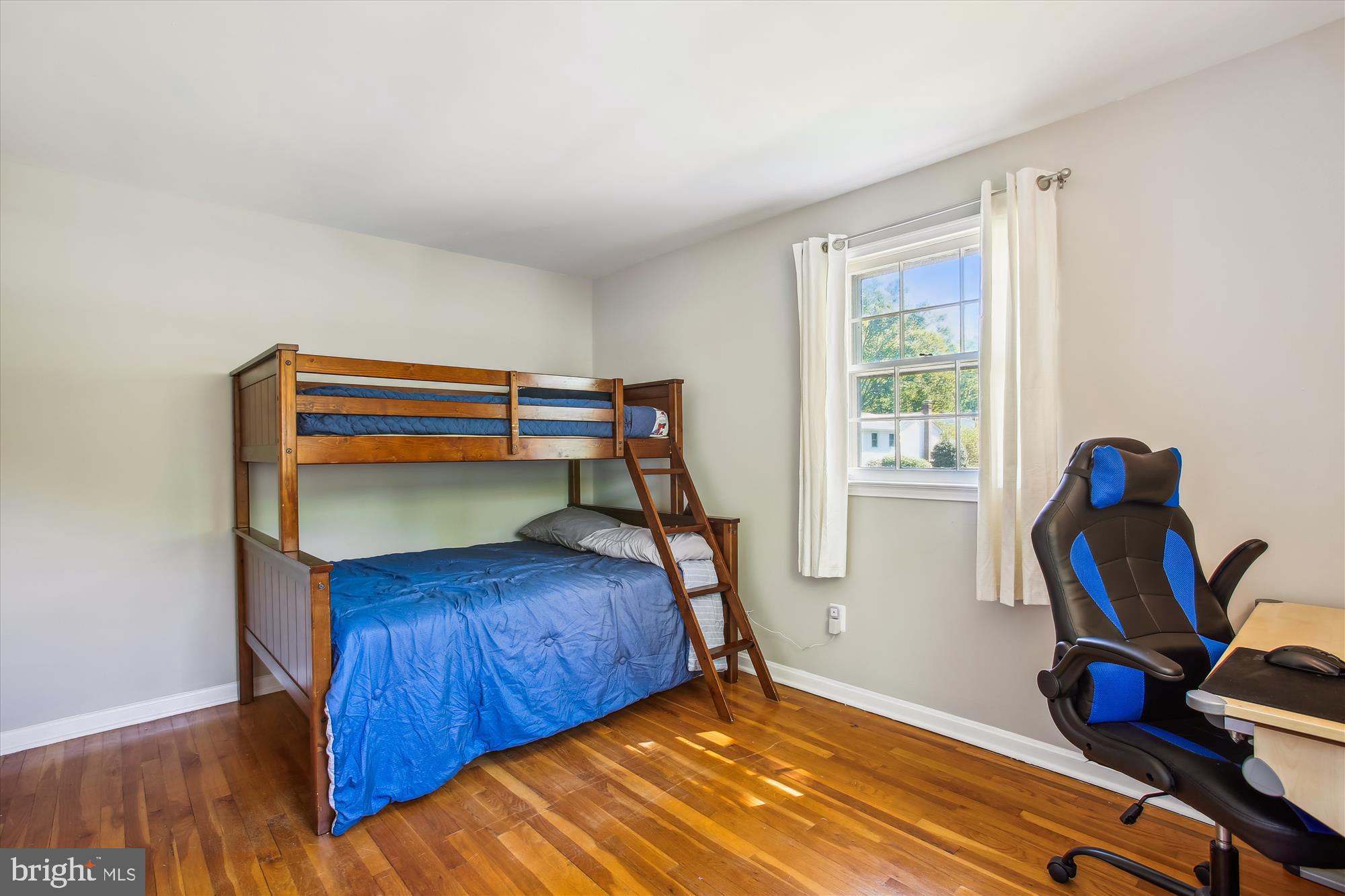 6961 Conservation Drive Springfield, VA 22153 - Photo 23 of 62 a bedroom with bed and a wooden floor
