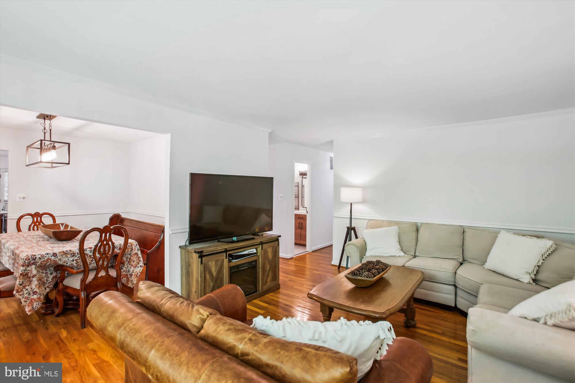 6961 Conservation Drive Springfield, VA 22153 - Photo 29 of 62 a living room with furniture and a flat screen tv