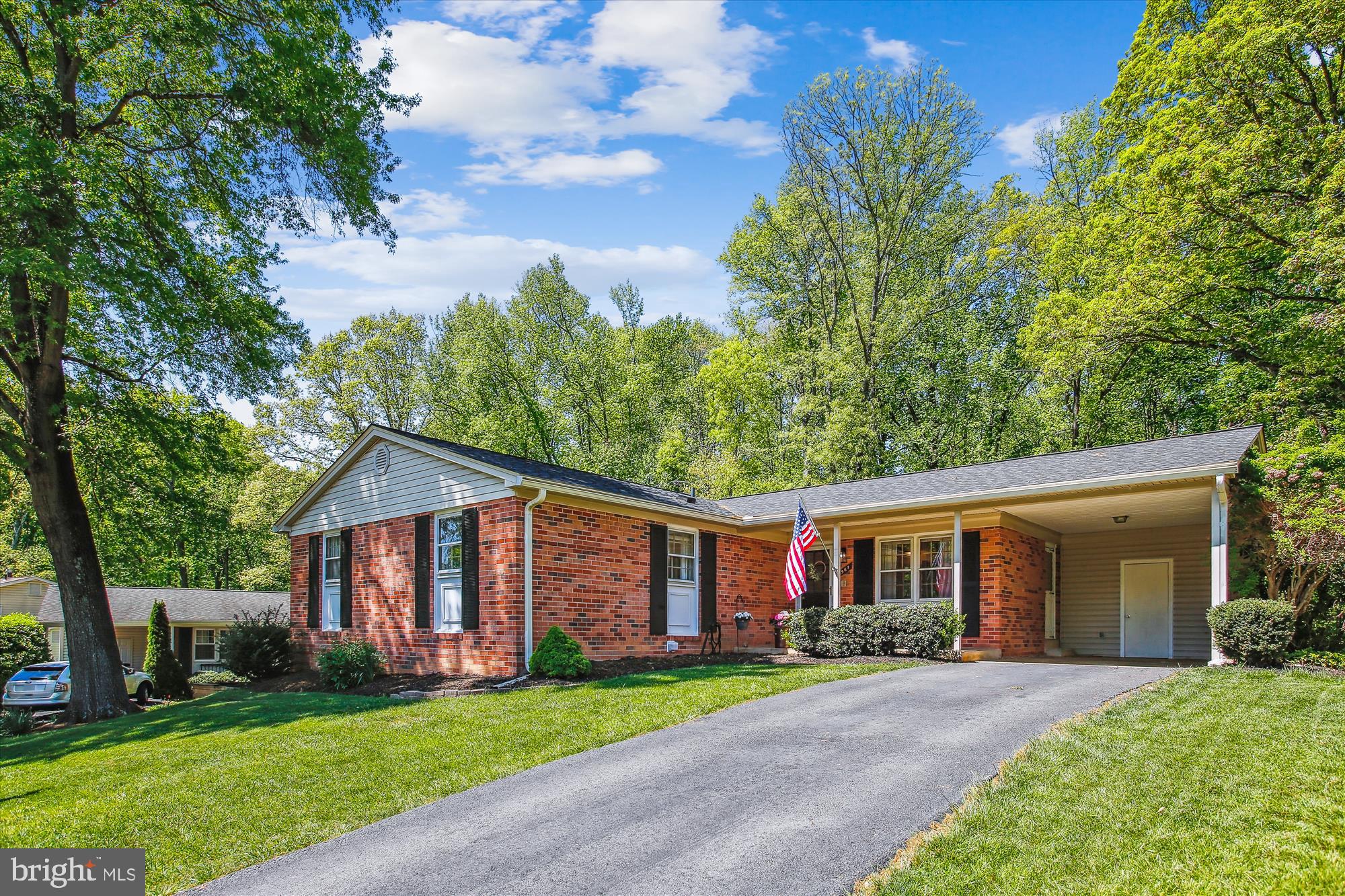 6961 Conservation Drive Springfield, VA 22153 - Photo 3 of 62 a view of a yard in front of a house with large tree