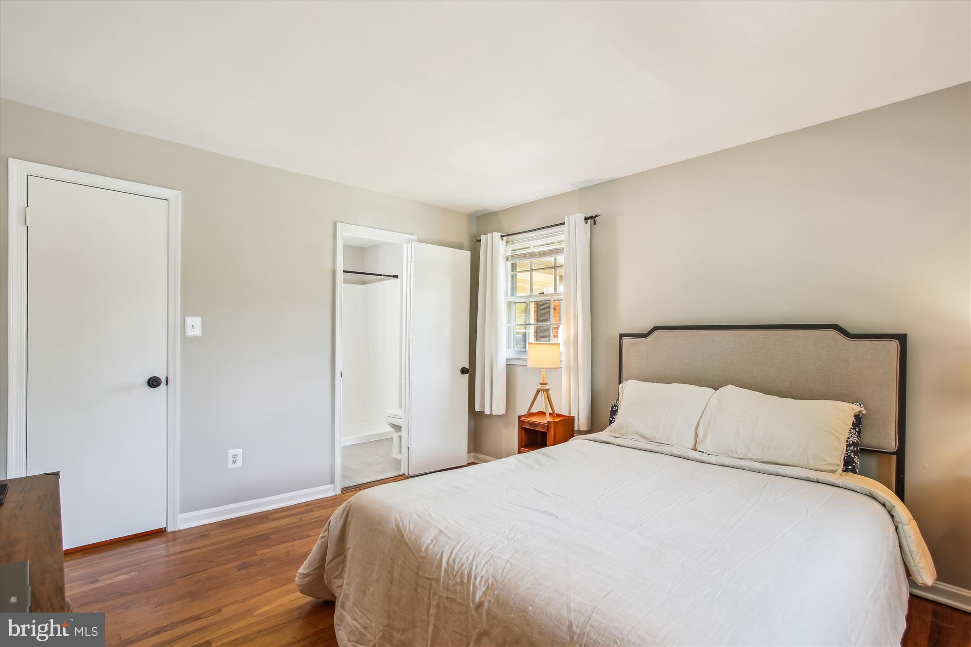 6961 Conservation Drive Springfield, VA 22153 - Photo 31 of 62 a bedroom with a bed and wooden floor
