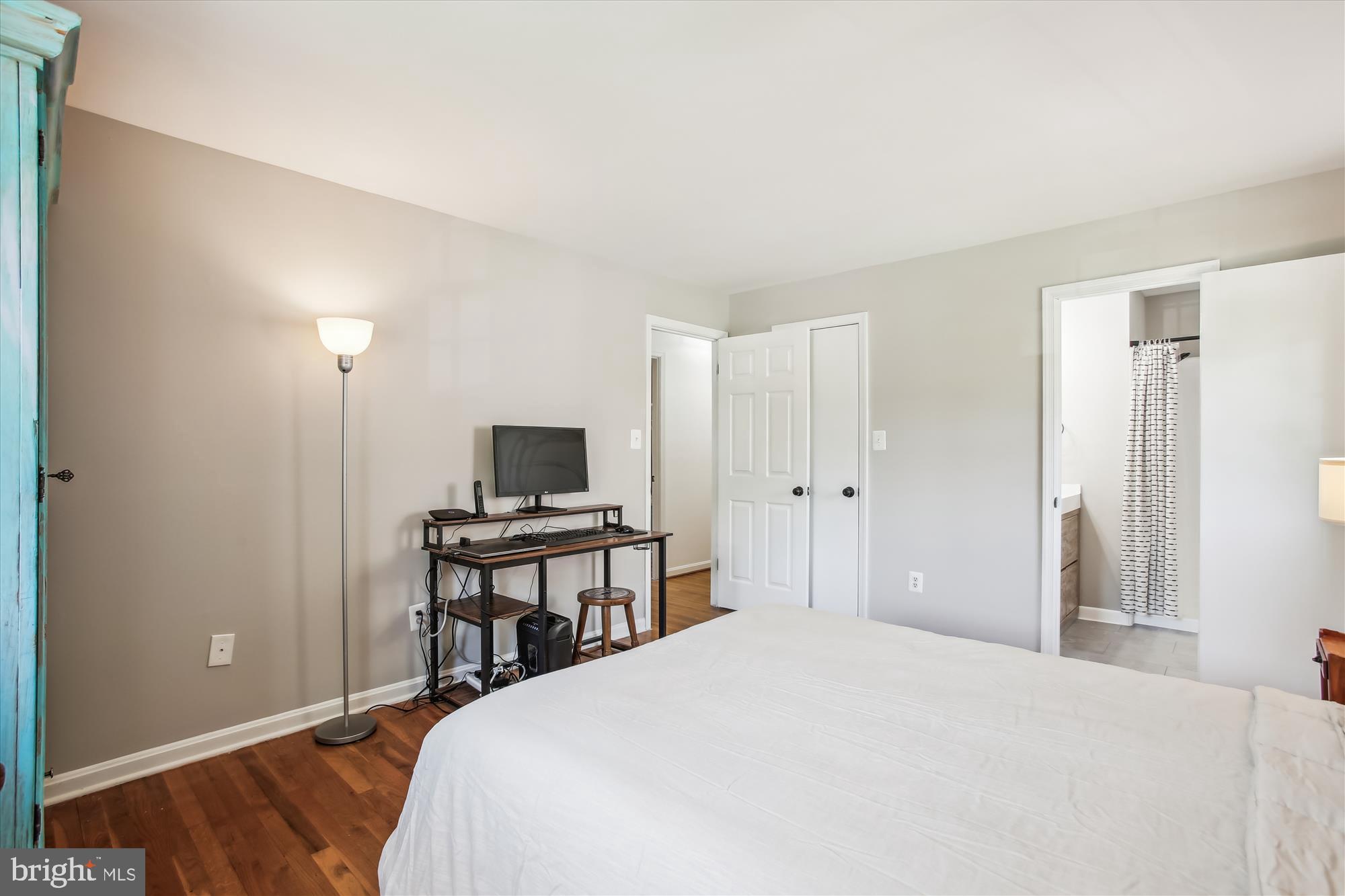 6961 Conservation Drive Springfield, VA 22153 - Photo 32 of 62 a bedroom with a bed and a flat screen tv