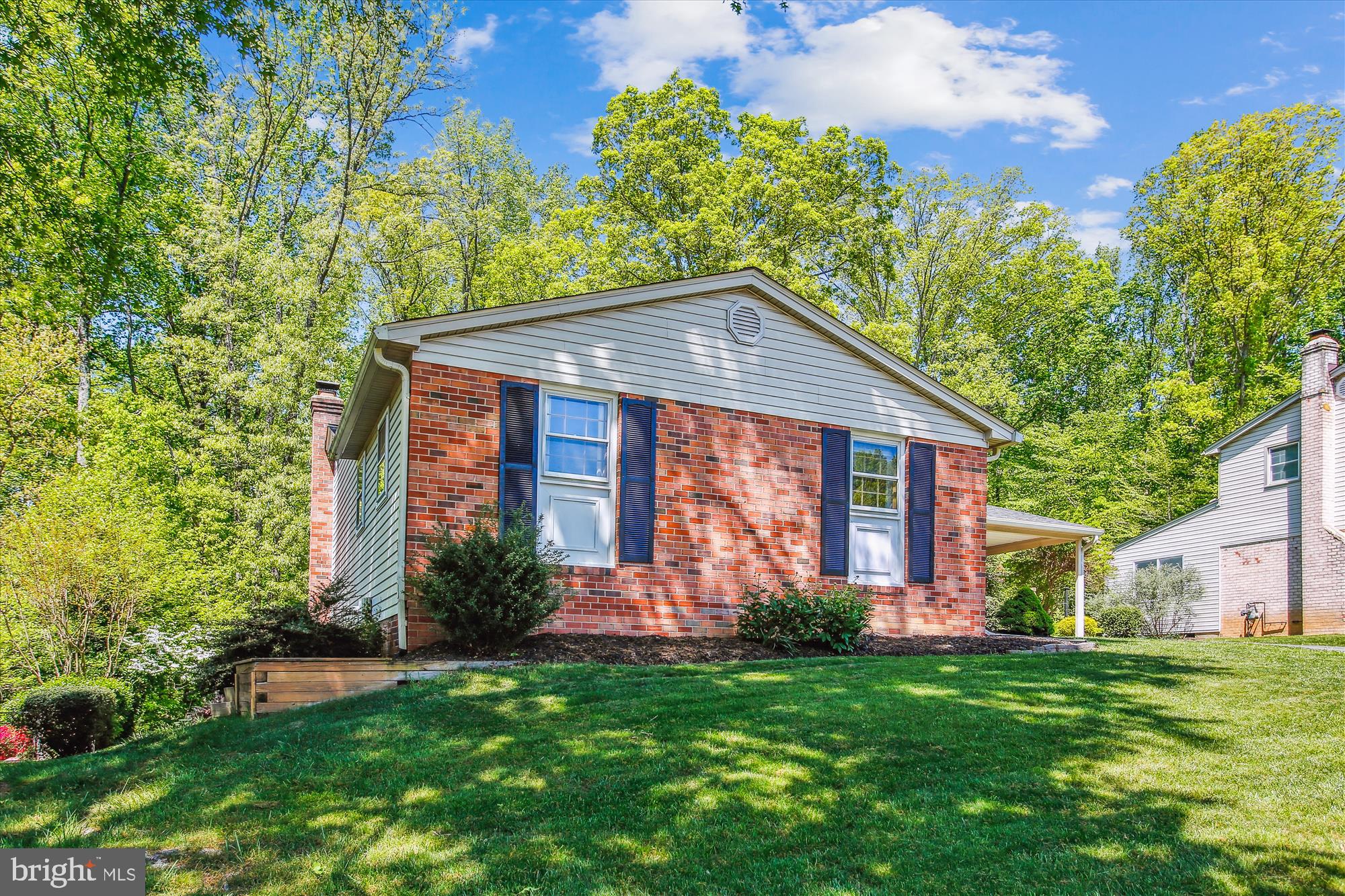 6961 Conservation Drive Springfield, VA 22153 - Photo 4 of 62 a front view of a house with a yard