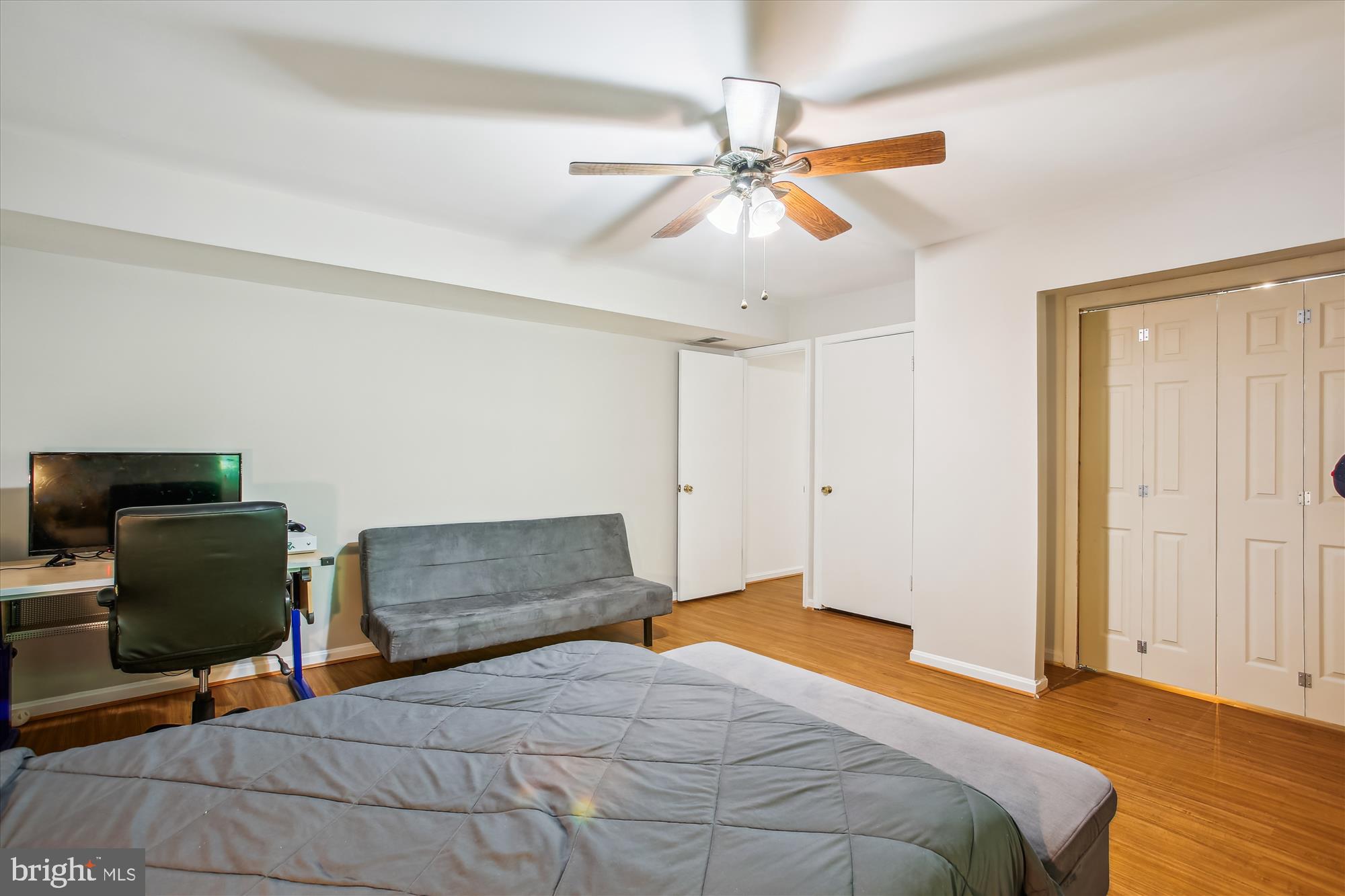 6961 Conservation Drive Springfield, VA 22153 - Photo 42 of 62 a bedroom with a bed and window