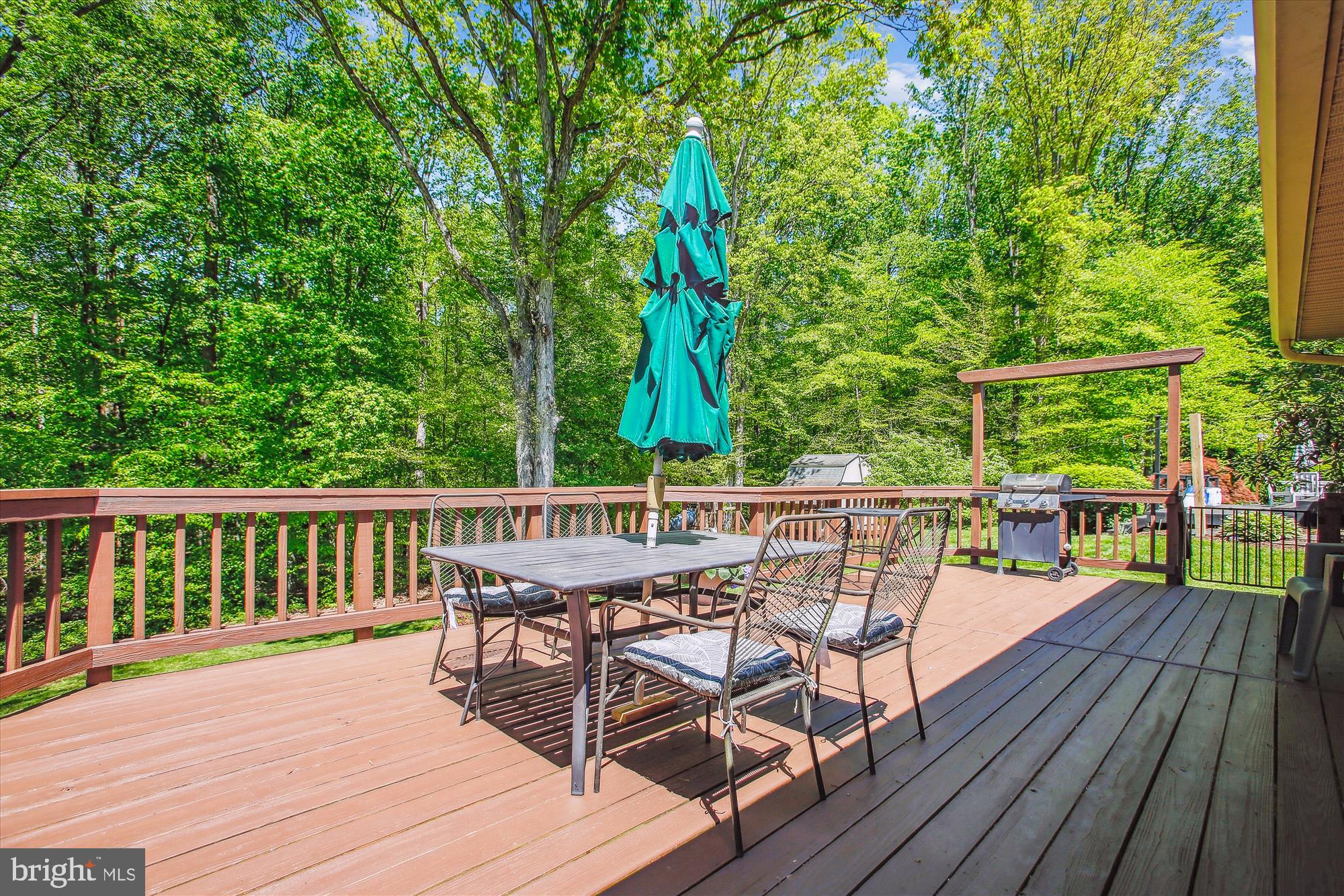 6961 Conservation Drive Springfield, VA 22153 - Photo 46 of 62 a view of a deck with two chair and wooden floor
