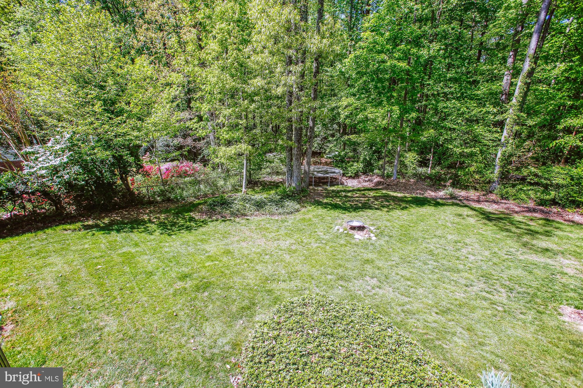 6961 Conservation Drive Springfield, VA 22153 - Photo 52 of 62 a backyard of a house with table and chairs