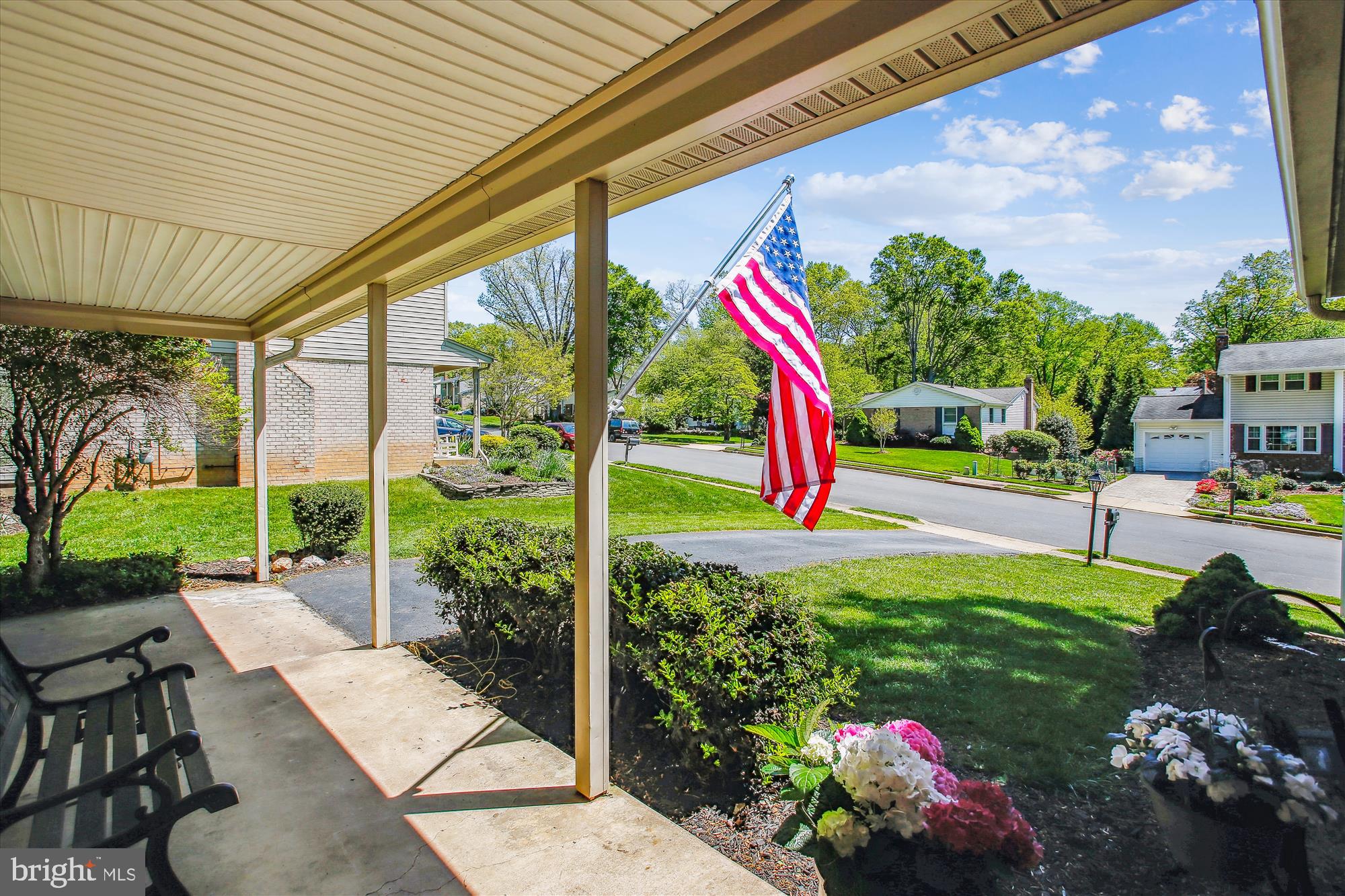 6961 Conservation Drive Springfield, VA 22153 - Photo 6 of 62 a view of a garden with plants and a bench