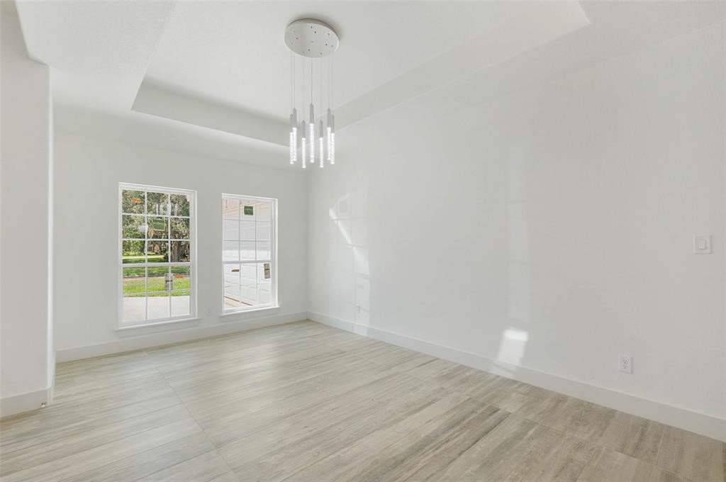2291 Riverside Drive West Columbia, TX 77486 - Photo 35 of 50 a view of an empty room with wooden floor and a window