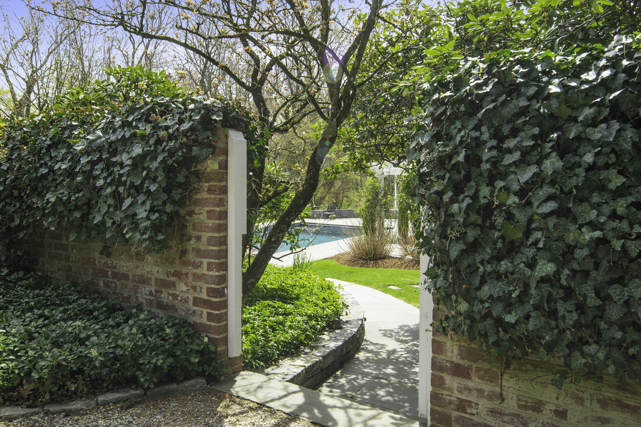 176 Michigan Road New Canaan, CT 06840 - Photo 41 of 42 Peak at pool through garden gate