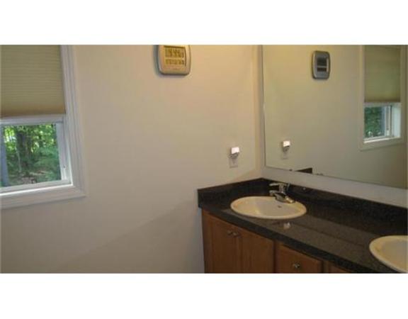 45 Tannery Road Sturbridge, MA 01518 - Photo 20 of 30 a bathroom with a sink a mirror and a toilet