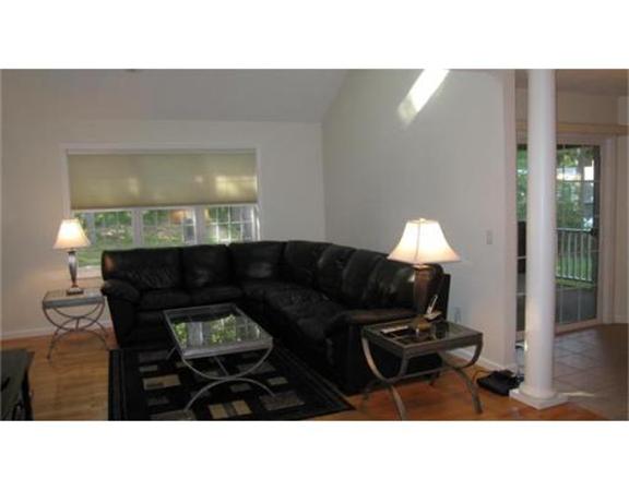 45 Tannery Road Sturbridge, MA 01518 - Photo 9 of 30 a living room with furniture and a lamp