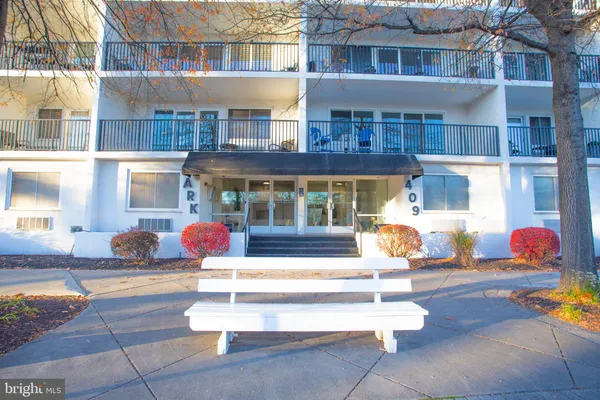 a front view of building with outdoor seating