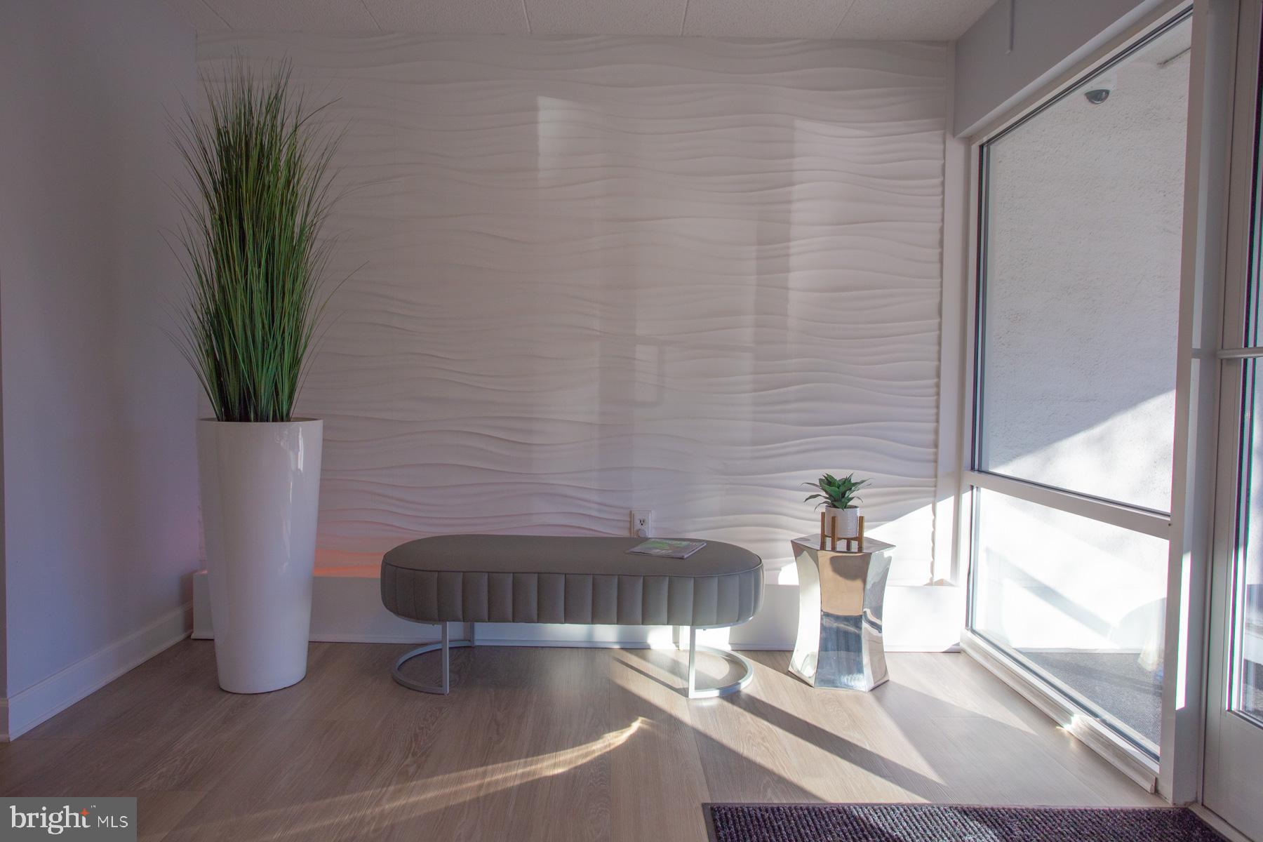 409 Rehoboth Avenue, Unit 20 Rehoboth Beach, DE 19971 - Photo 3 of 31 a bathroom with a sink and a potted plant