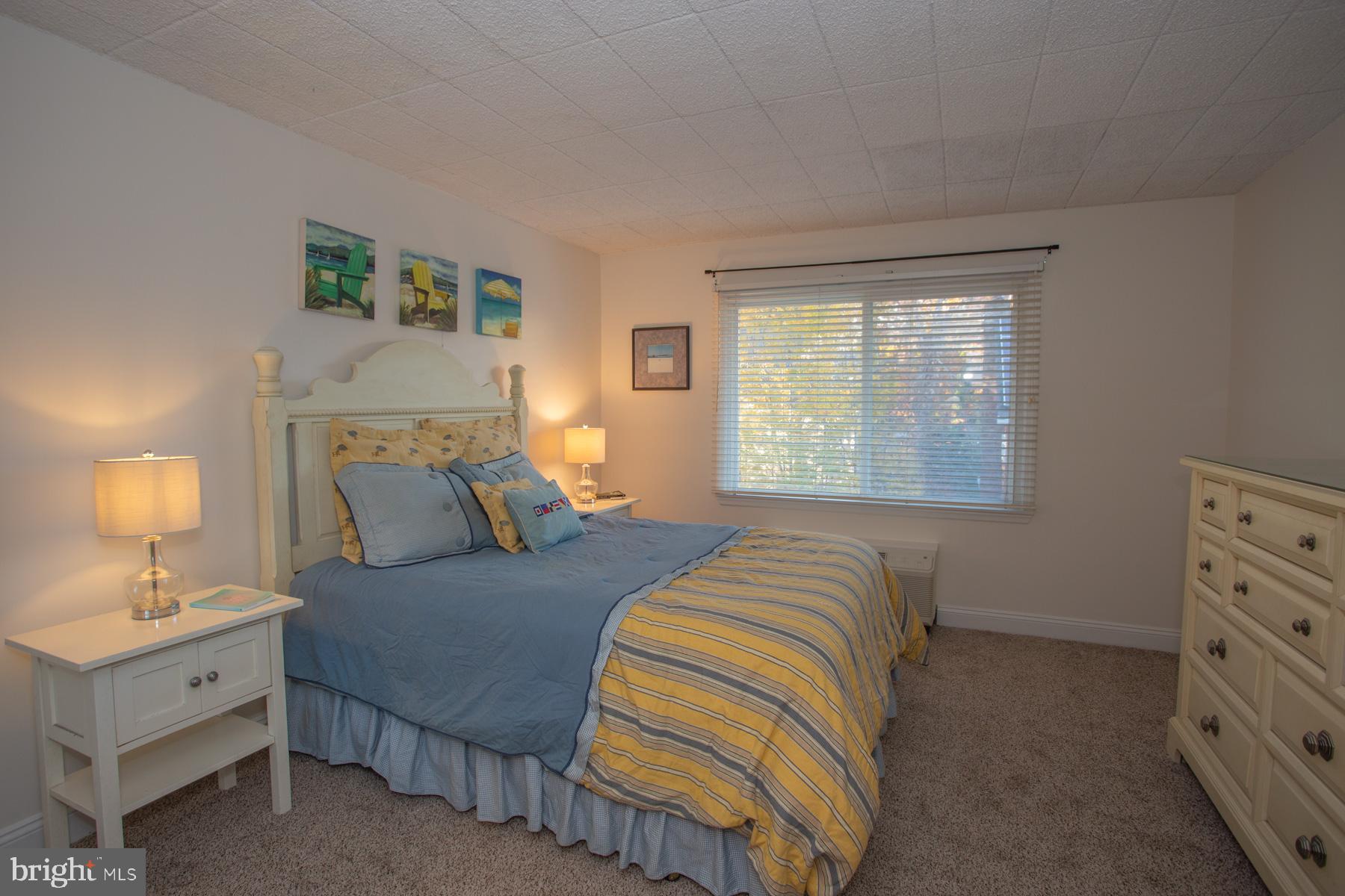 409 Rehoboth Avenue, Unit 20 Rehoboth Beach, DE 19971 - Photo 9 of 31 a bedroom with a bed and a closet