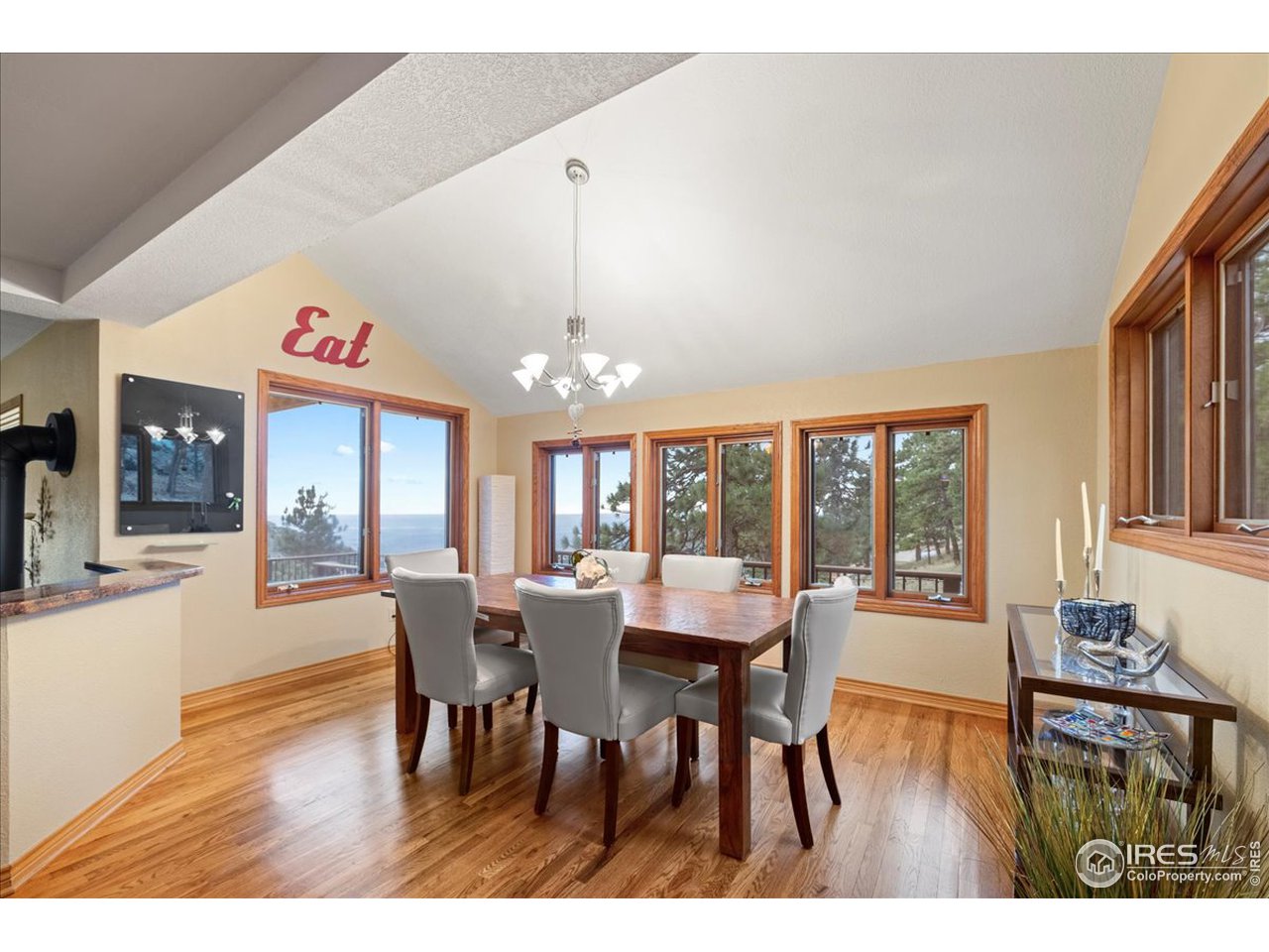 6293 Red Hill Road Boulder, CO 80302 - Photo 12 of 40 a view of a dining room with furniture window and wooden floor