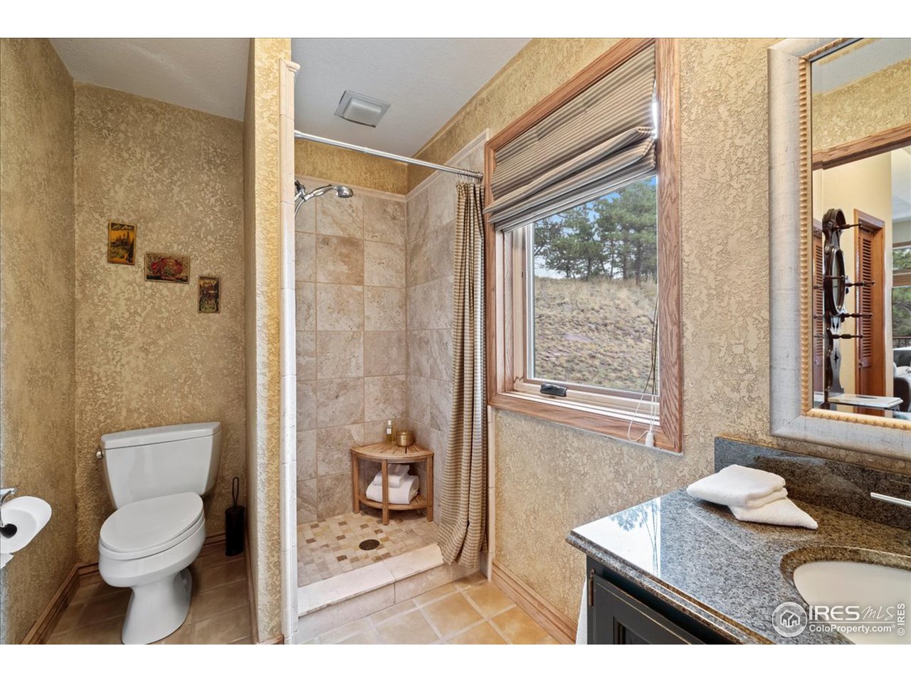 6293 Red Hill Road Boulder, CO 80302 - Photo 17 of 40 a bathroom with a granite countertop sink toilet and shower