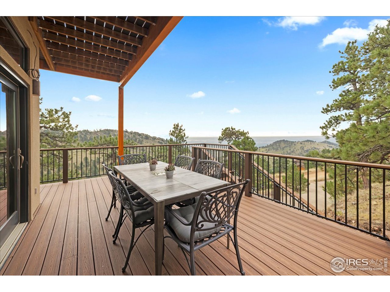6293 Red Hill Road Boulder, CO 80302 - Photo 26 of 40 a view of a balcony with furniture and wooden floor