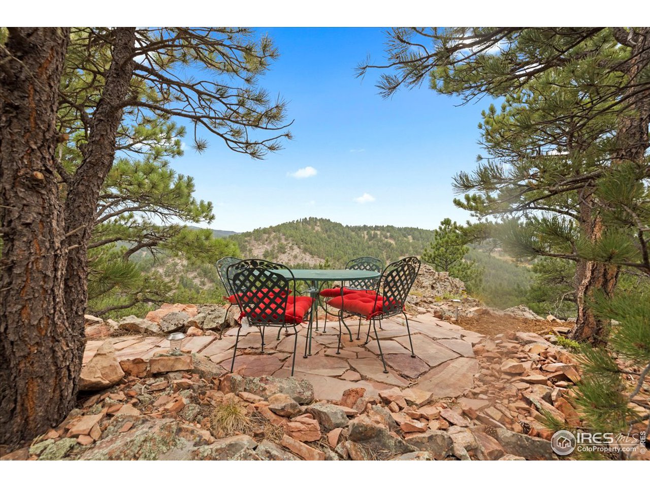 6293 Red Hill Road Boulder, CO 80302 - Photo 37 of 40 a view of a backyard with a table and chairs