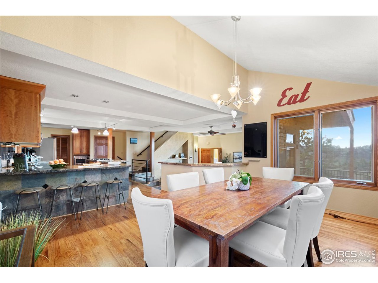 6293 Red Hill Road Boulder, CO 80302 - Photo 10 of 40 a dining hall with dining table and chairs