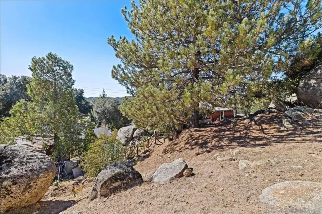 a view of a large house with a yard covered with snow in front of house