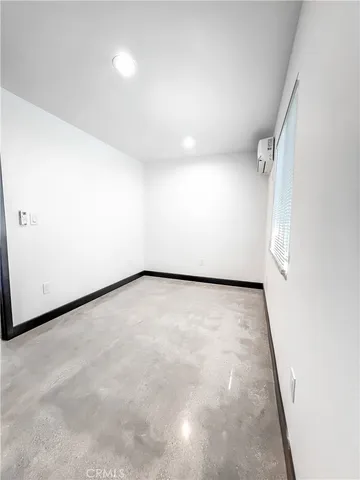 an empty room with wooden floor