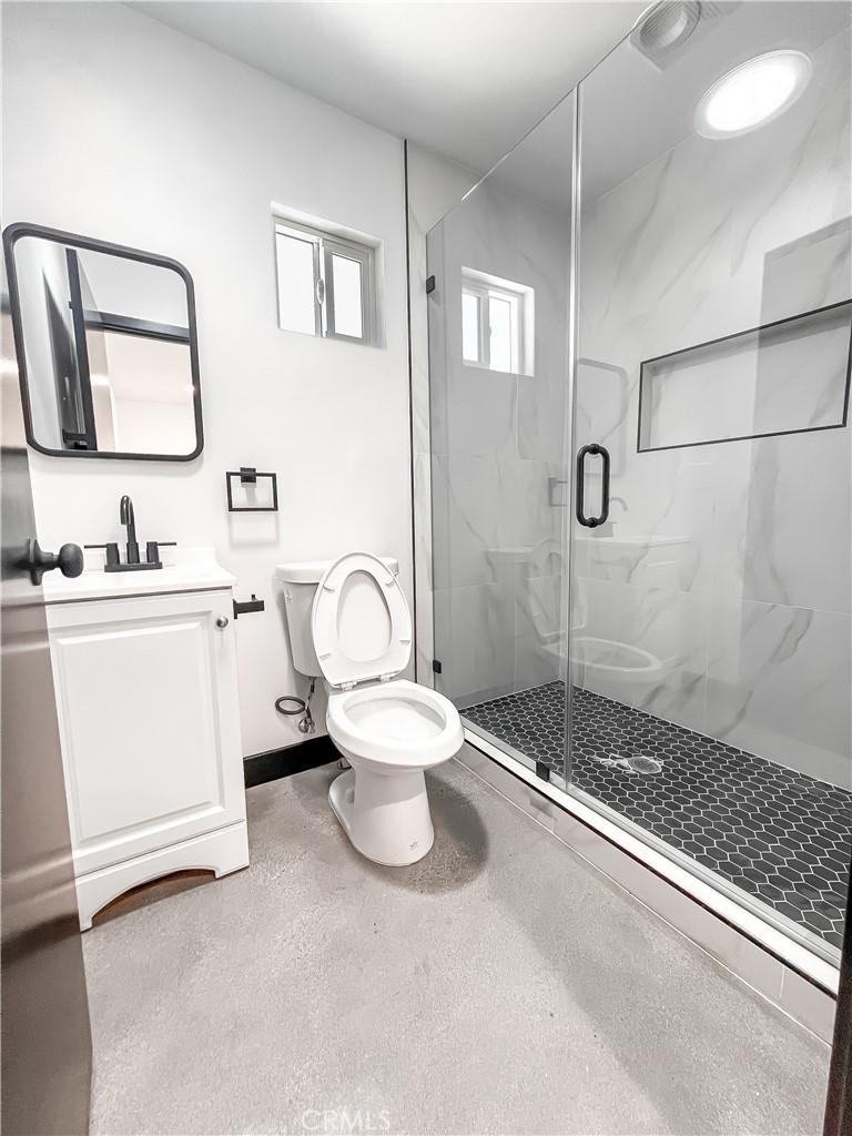 3633 Trinity Street, Unit 1/2 Los Angeles, CA 90011 - Photo 8 of 10 a bathroom with a sink a toilet and shower