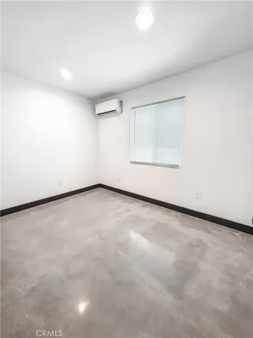 an empty room with a empty space and a window