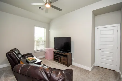 a view of a livingroom with furniture and window