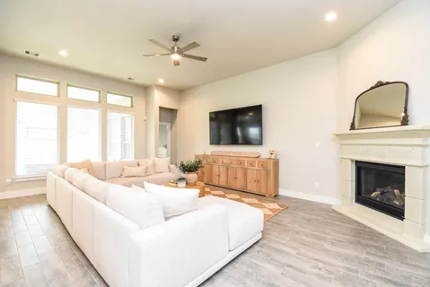 a living room with furniture and a fireplace