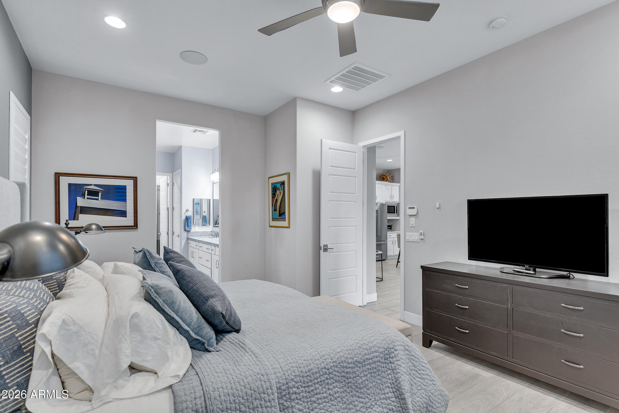 622 West Deer Creek Road Phoenix, AZ 85048 - Photo 23 of 39 a bedroom with a bed and a flat screen tv