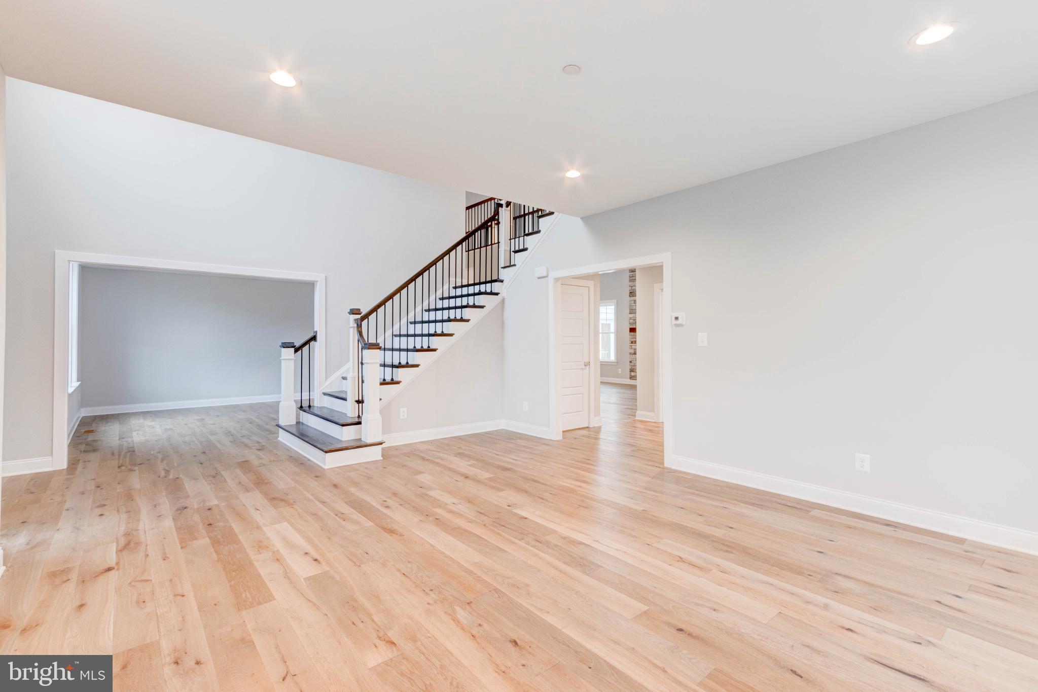 3114 Mt Zion Road Upperco, MD 21155 - Photo 12 of 61 a view of empty room with wooden floor and stairs