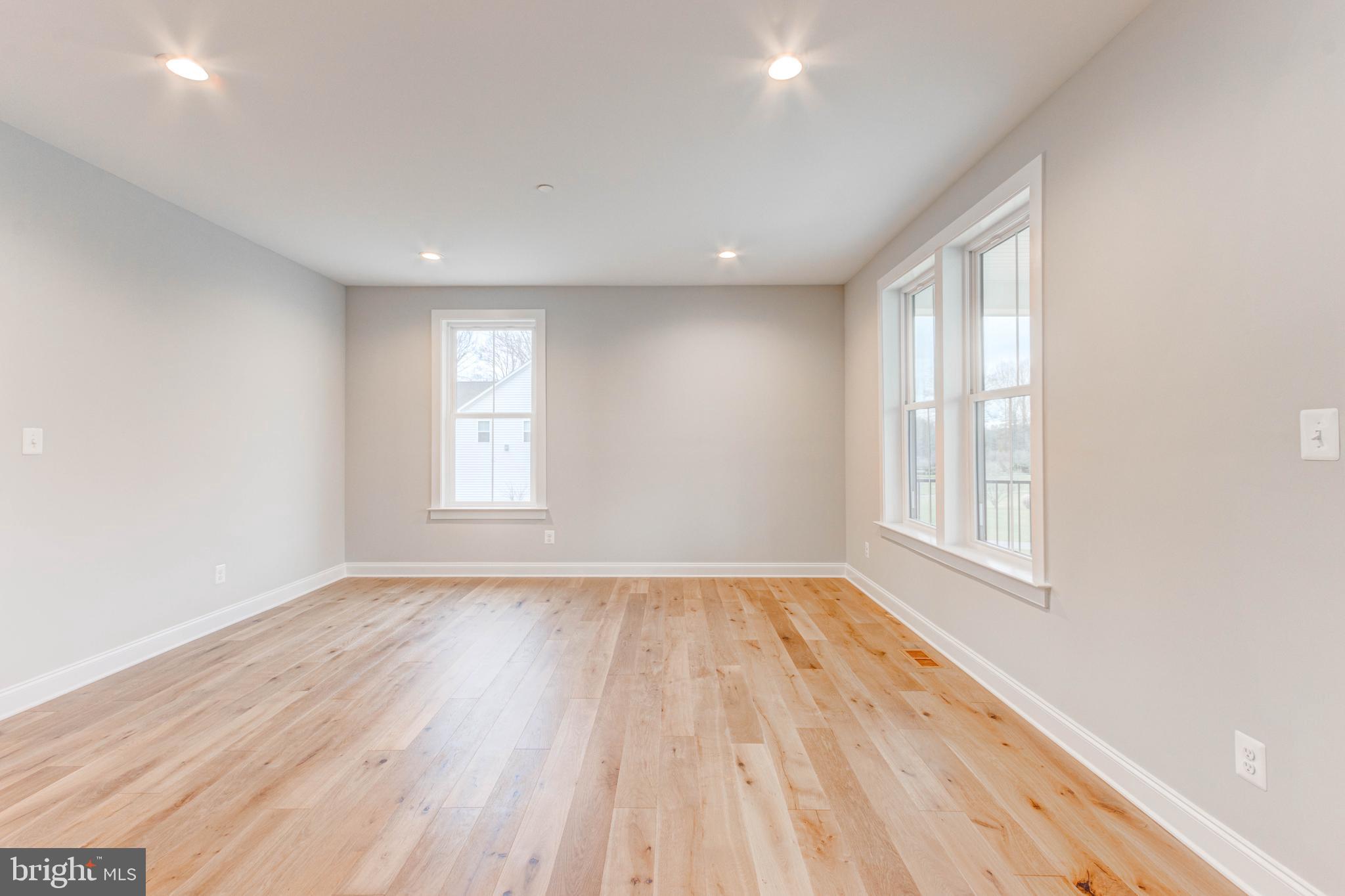 3114 Mt Zion Road Upperco, MD 21155 - Photo 14 of 61 an empty room with wooden floor and windows