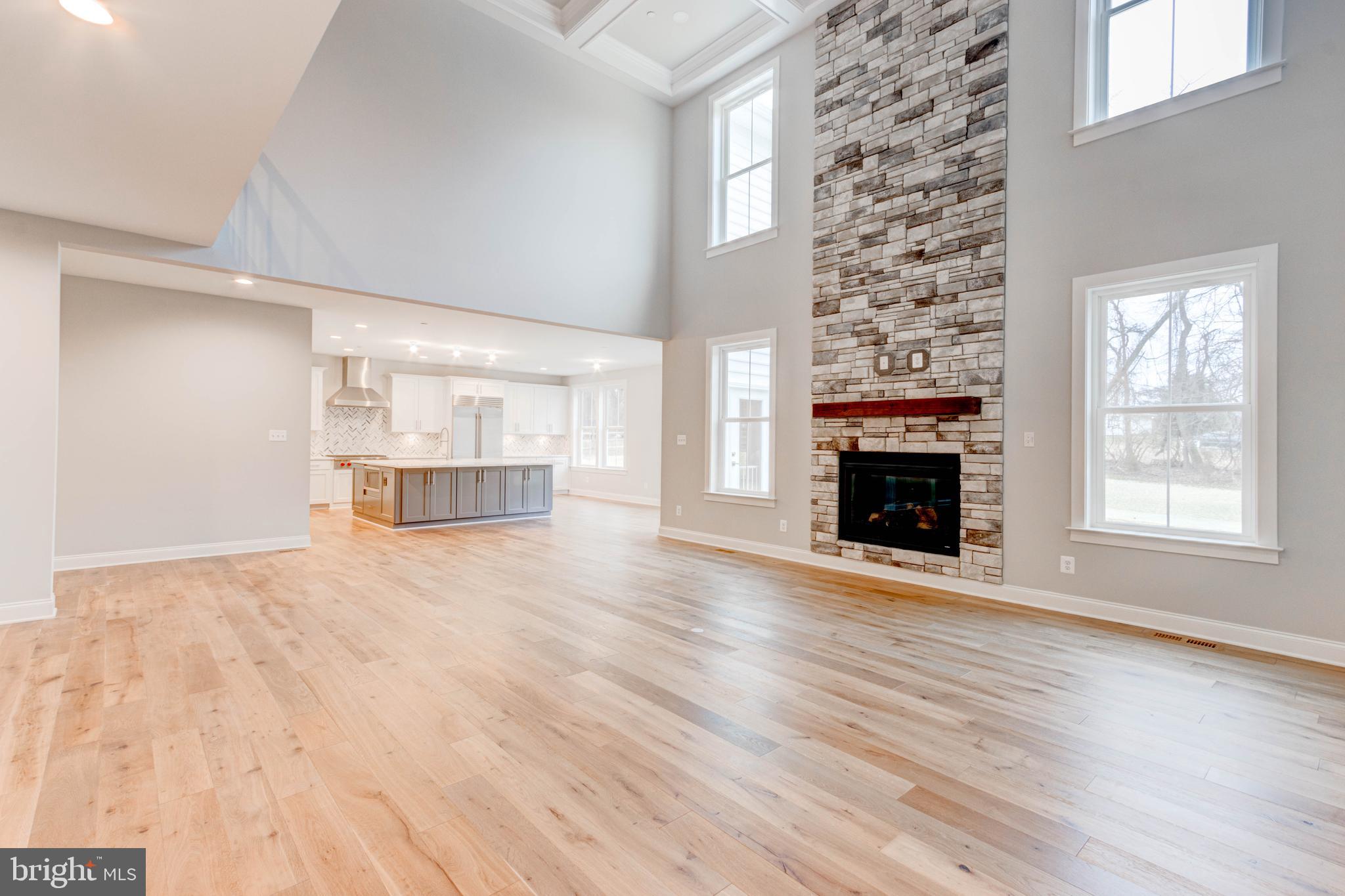 3114 Mt Zion Road Upperco, MD 21155 - Photo 17 of 61 a view of empty room with wooden floor and fireplace