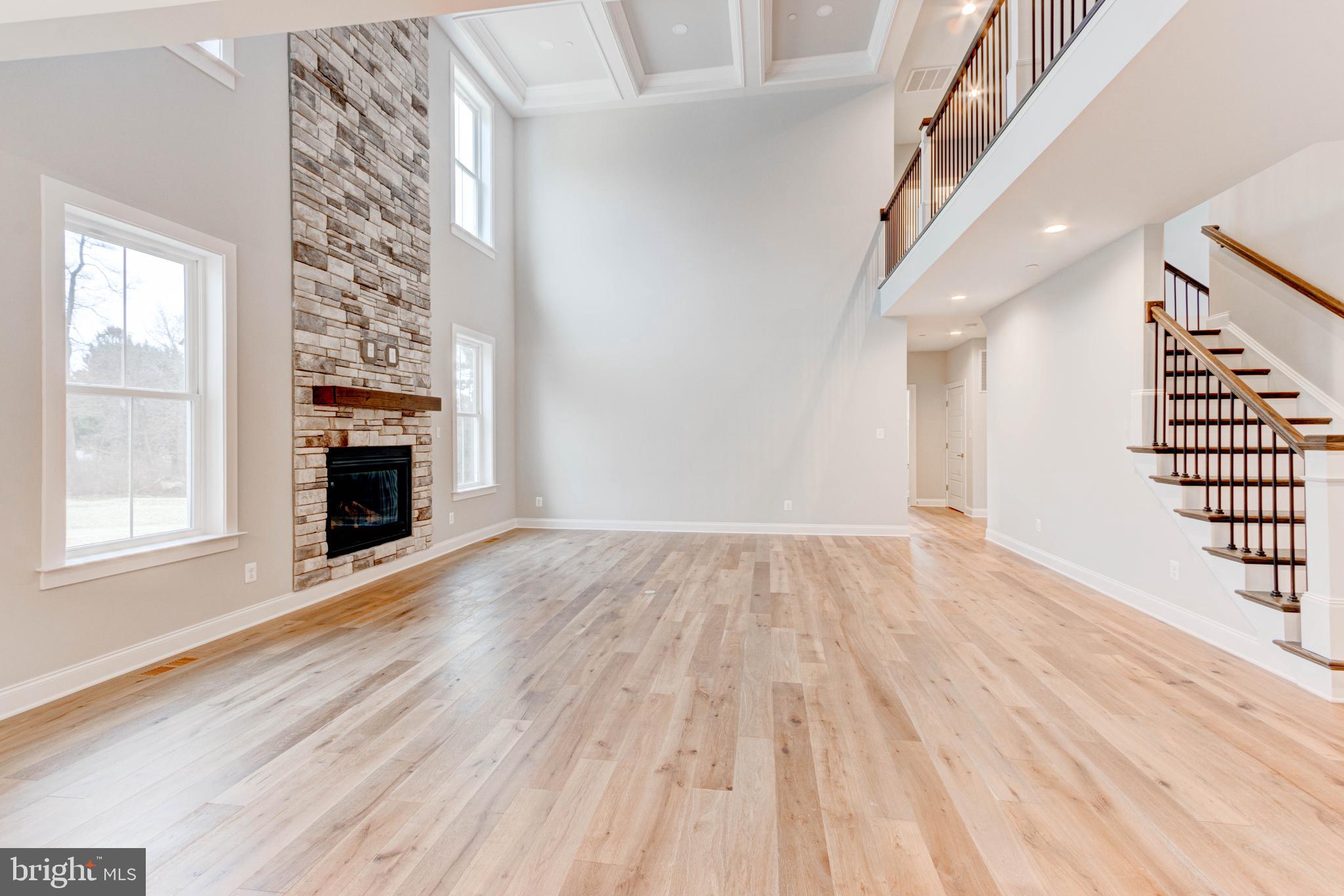 3114 Mt Zion Road Upperco, MD 21155 - Photo 18 of 61 a view of an empty room with wooden floor fireplace and a window