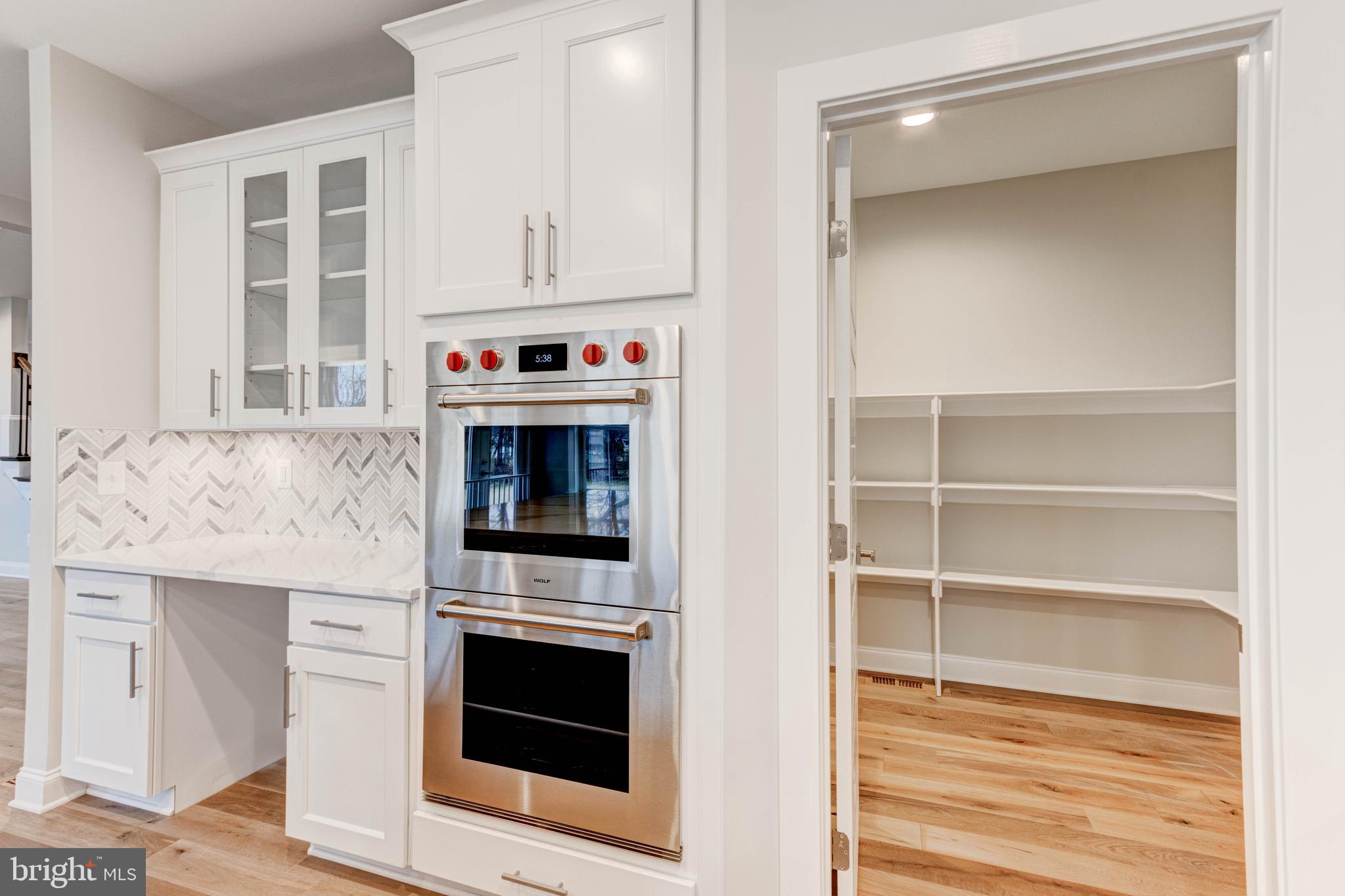 3114 Mt Zion Road Upperco, MD 21155 - Photo 23 of 61 a kitchen with granite countertop white cabinets and stainless steel appliances