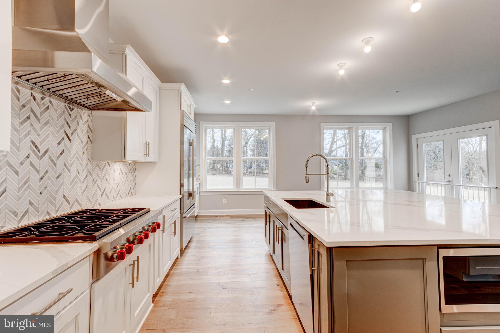 3114 Mt Zion Road Upperco, MD 21155 - Photo 24 of 61 a kitchen with granite countertop a stove and a sink