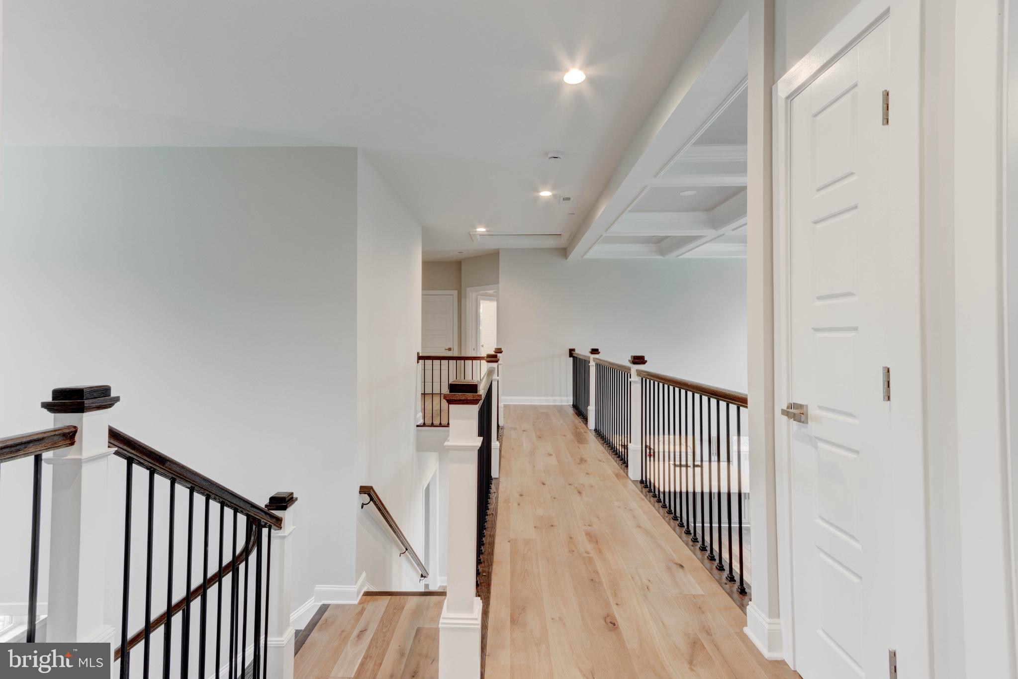 3114 Mt Zion Road Upperco, MD 21155 - Photo 32 of 61 a view of a hallway with wooden floor and stairs