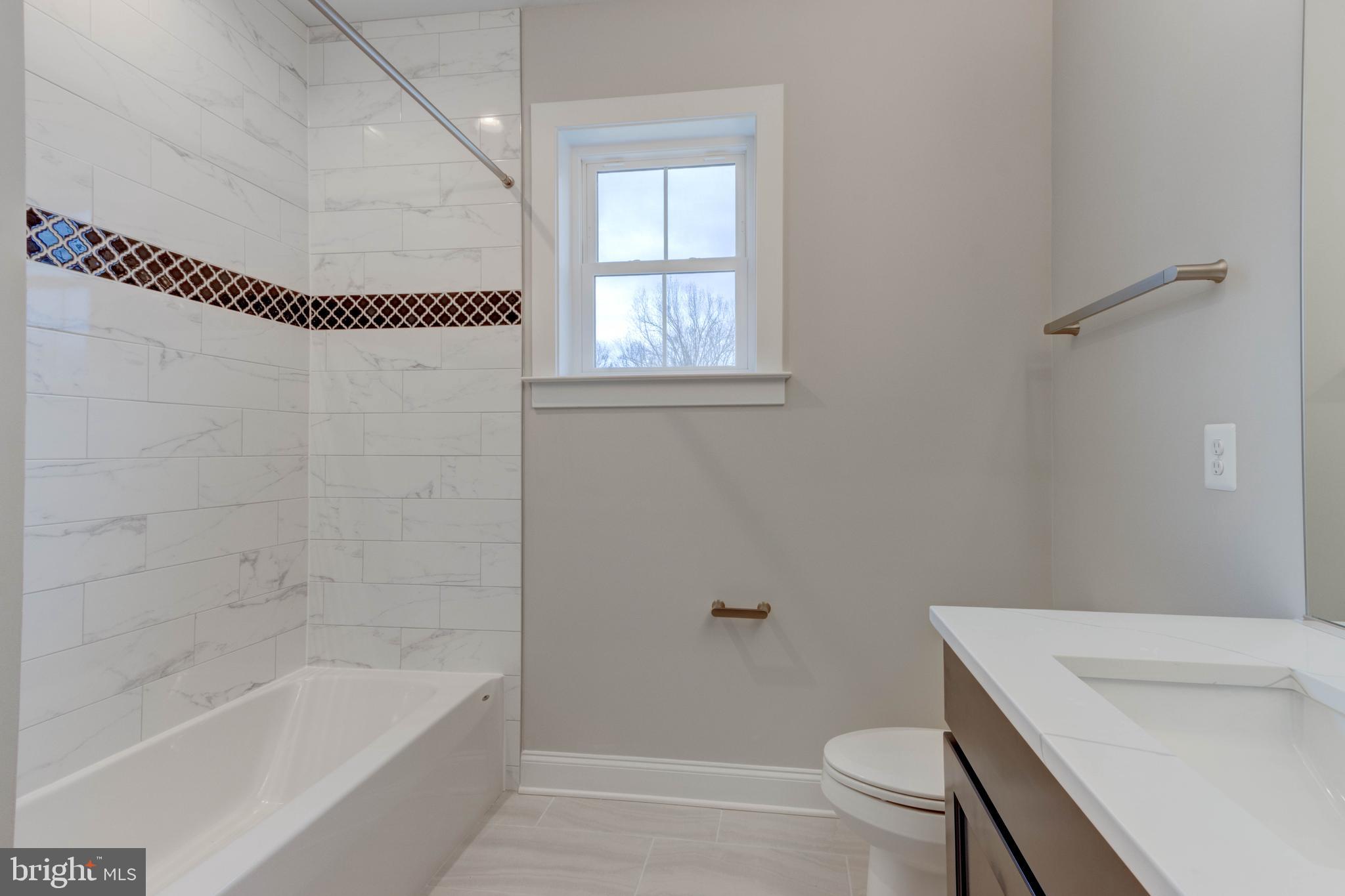 3114 Mt Zion Road Upperco, MD 21155 - Photo 34 of 61 a bathroom with a sink a toilet and shower