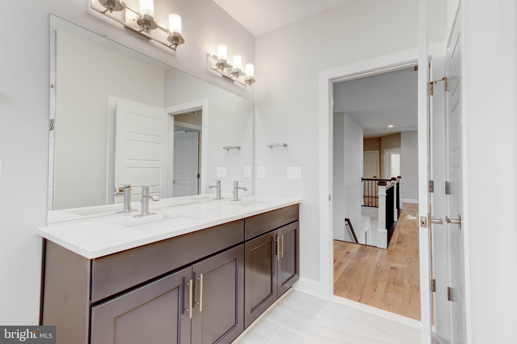 3114 Mt Zion Road Upperco, MD 21155 - Photo 35 of 61 a bathroom with a sink vanity and a mirror