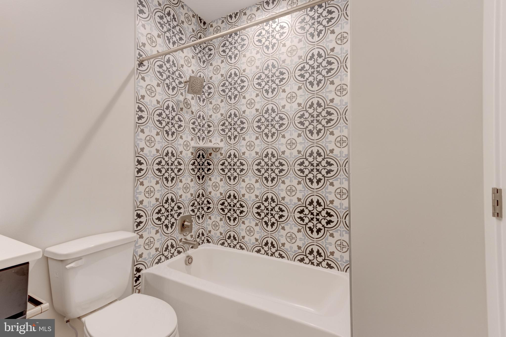 3114 Mt Zion Road Upperco, MD 21155 - Photo 41 of 61 a bathroom with a toilet and a shower curtain