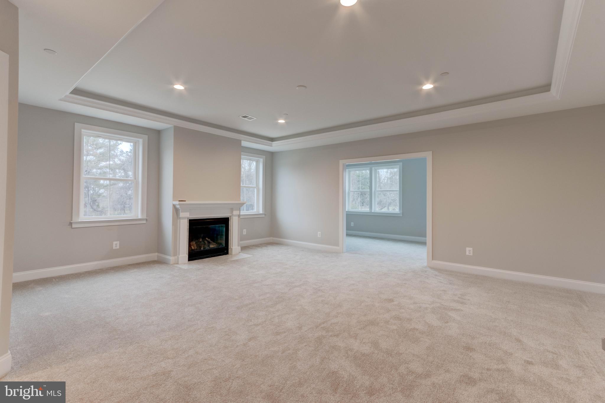 3114 Mt Zion Road Upperco, MD 21155 - Photo 44 of 61 an empty room with windows and fireplace